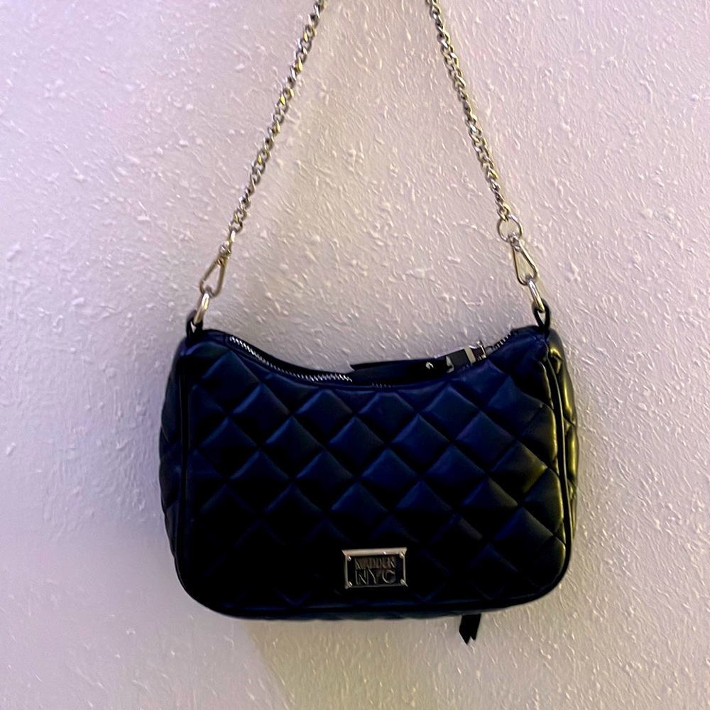 Vintage Steve Madden carry size purse with outside and inside pockets.